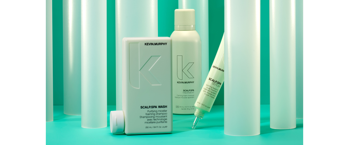 KEVIN.MURPHY haircare products displayed against a background of teal and white cylindrical shapes, including SCALP.SPA WASH and SCALP.SPA SERUM.